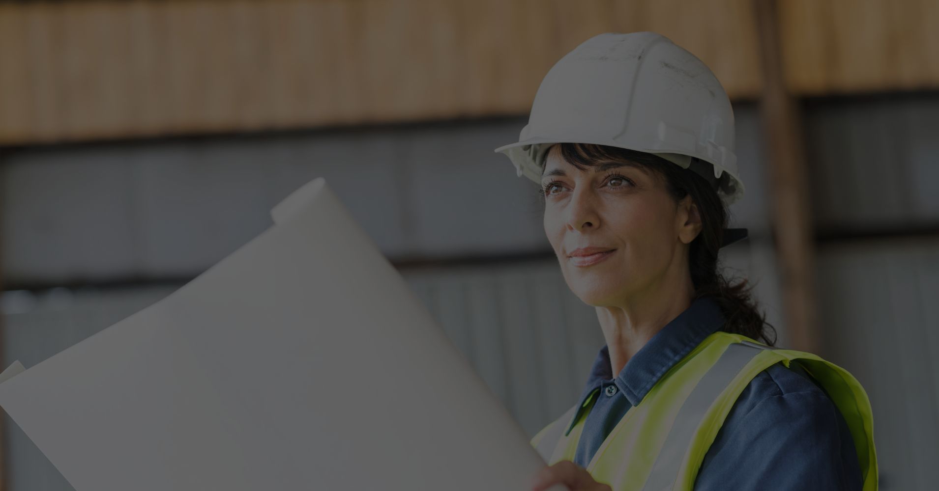 woman in construction looking at plans